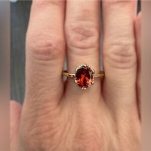 Garnet stone ring. Rose gold band. Size 8.